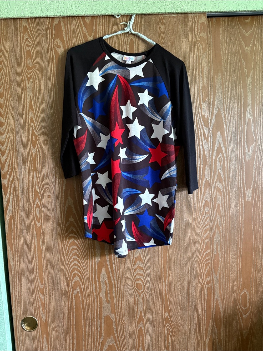 LuLaRoe Black Raglan Top with Red, White & Blue Star Print
